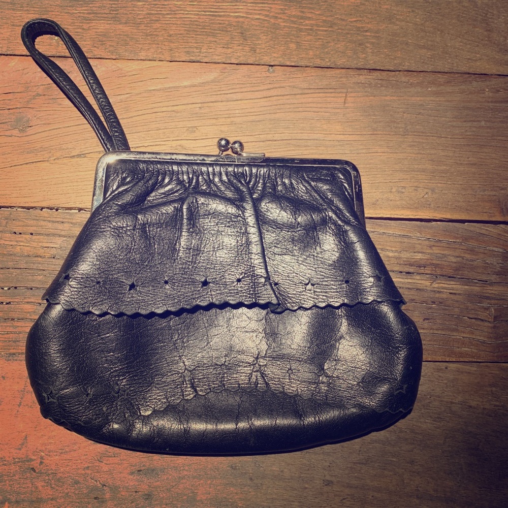 Claret black leather clutch.